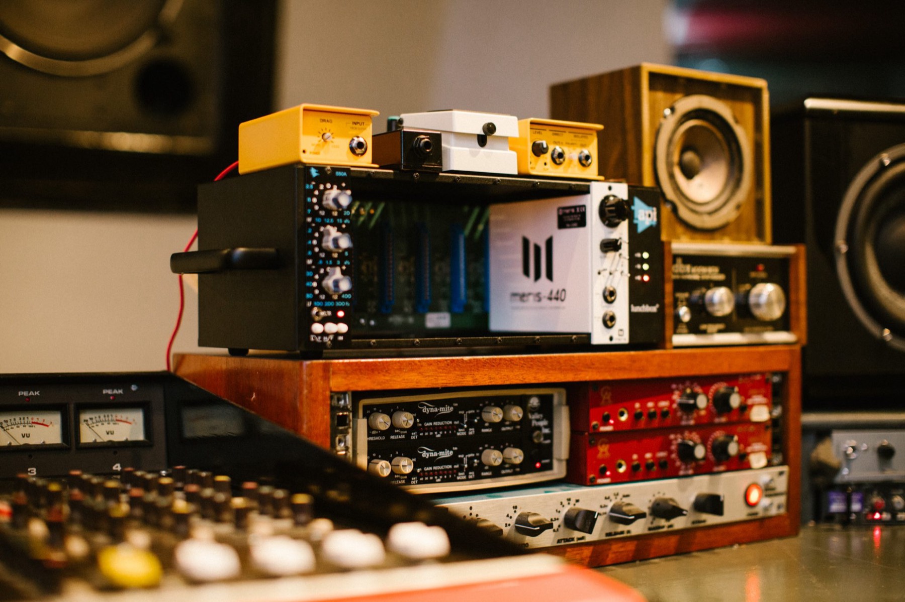Outboard rack stacked beneath monitors
